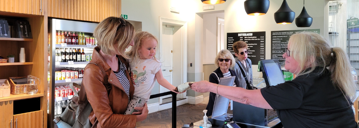 A customer being served in a cafe