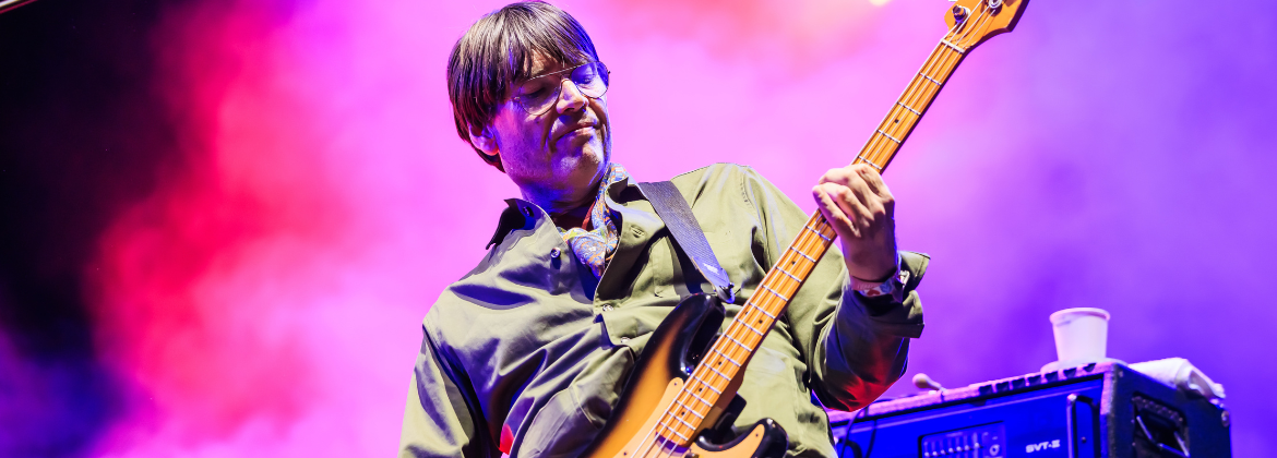 Musician Alex James playing guitar