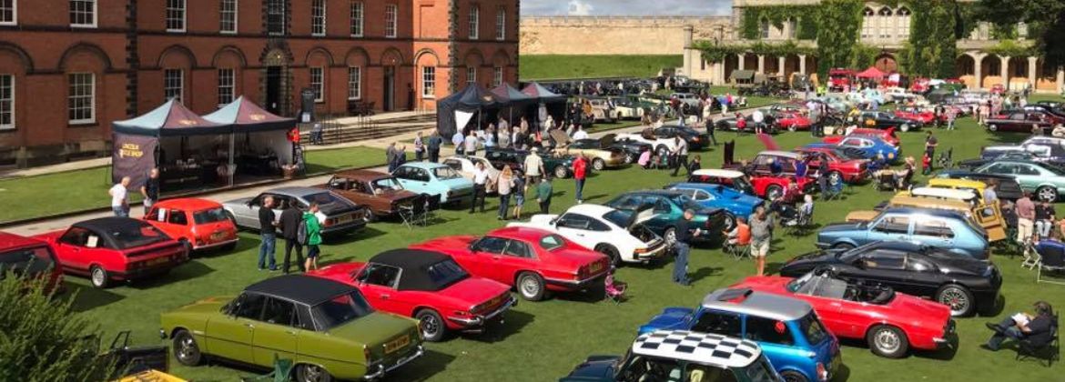 Photograph shows a selection of vintage vehicles