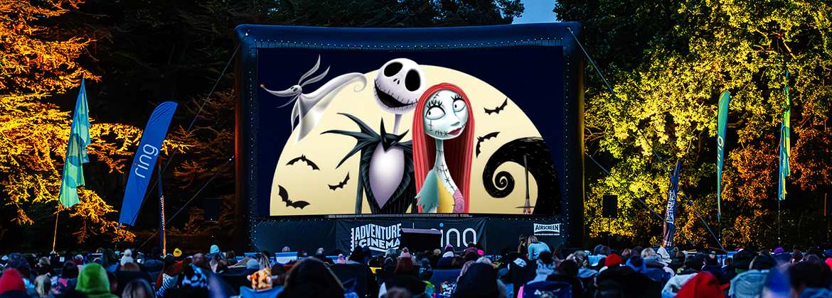 Outdoor cinema screen playing the movie 'The Nightmare Before Christmas'