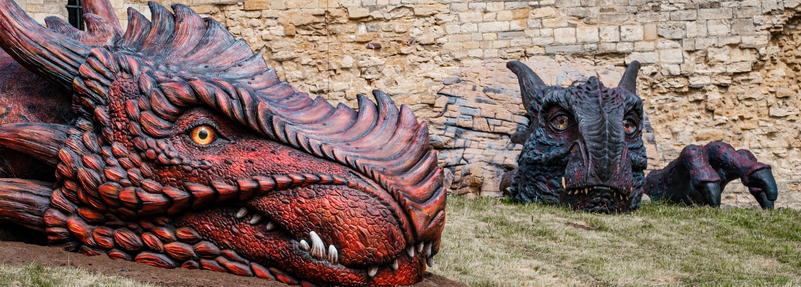 Two dragon sculptures placed on a bank of a castle