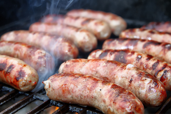Sausages grilling on a barbecue